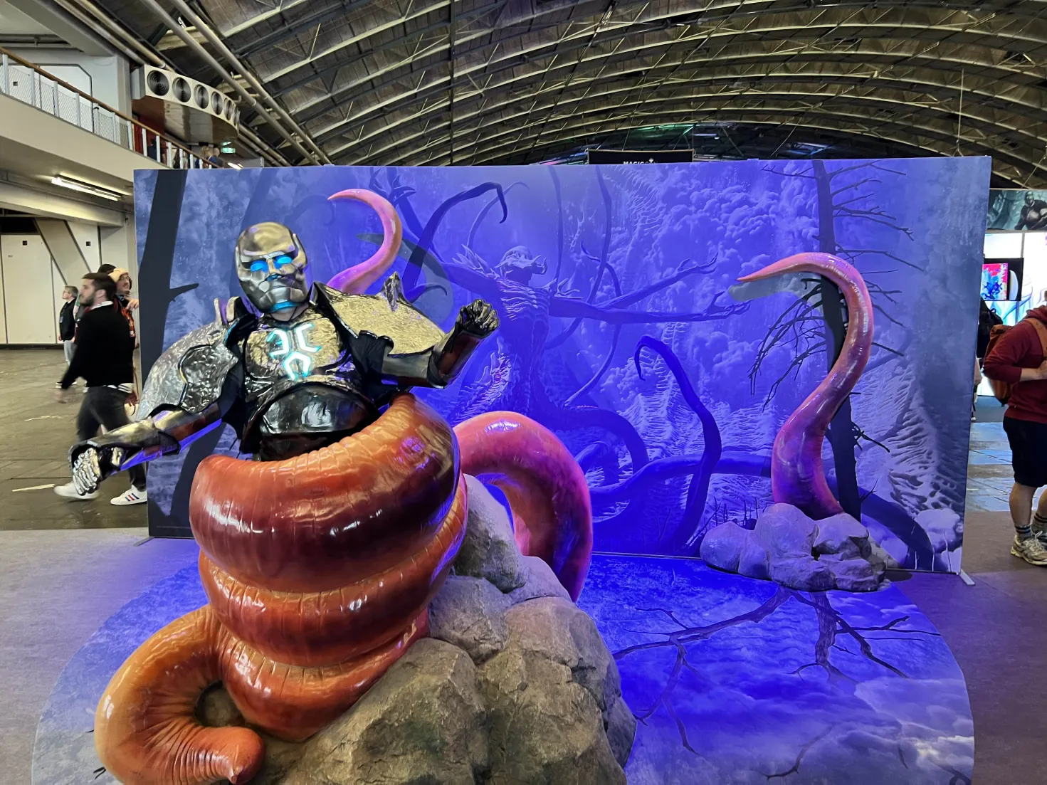 My Karn cosplay posing in an Eldrazi tentacle photo set at MagicCon Amsterdam 2024.