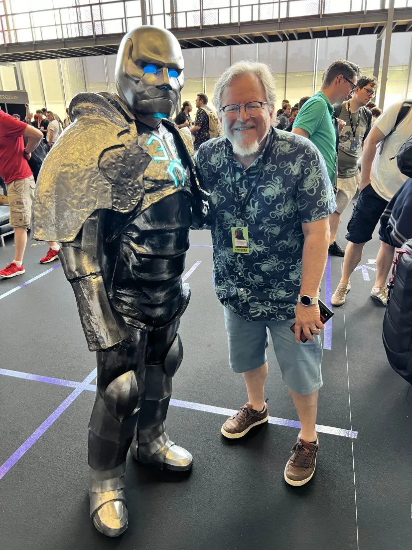 My Karn cosplay standing next to Magic artist Jeff Laubenstein.